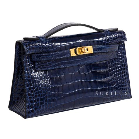 black hermes kelly with gold hardware|Hermes kelly pochette crocodile.